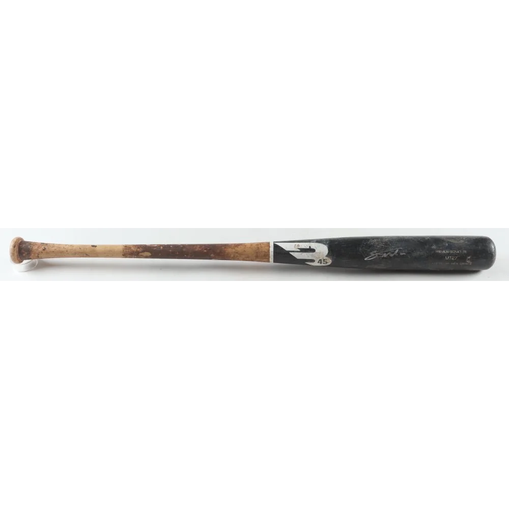 Well-used wooden baseball bat with dark barrel and worn handle from Noelvi Marte