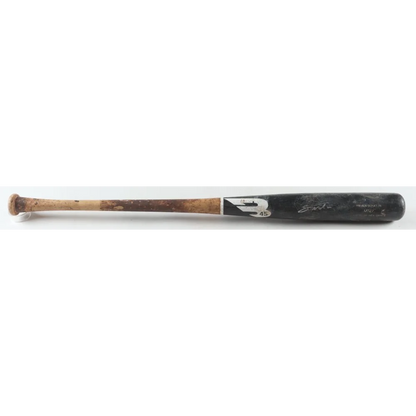 Well-used wooden baseball bat with dark barrel and worn handle from Noelvi Marte