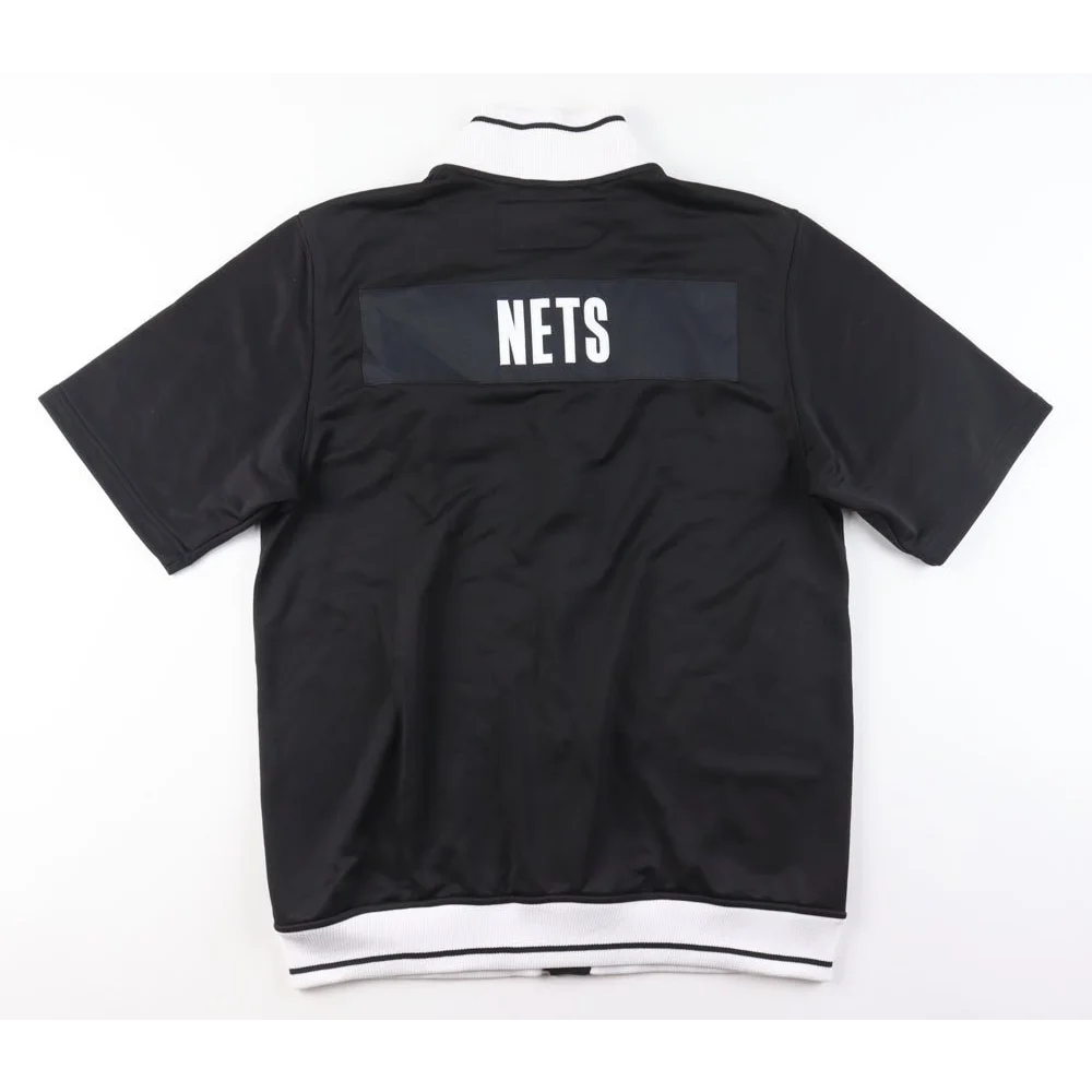 Black short-sleeve pullover with white collar and hem, perfect for Donald Sloan NBA fans