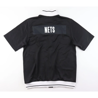 Black short-sleeve pullover with white collar and hem, perfect for Donald Sloan NBA fans