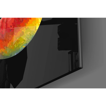 Vibrant Ganesha glass wall art in fiery orange and yellow circle