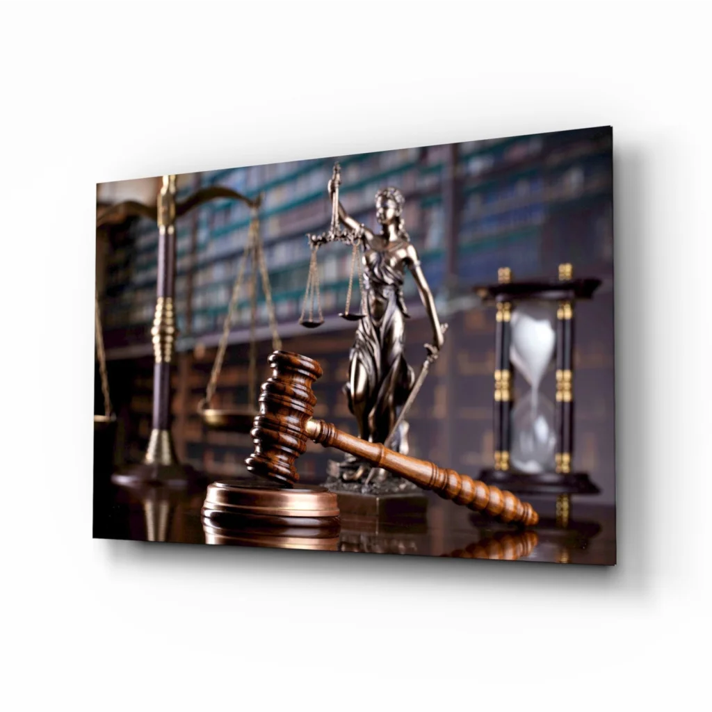Lady Justice bronze statue with scales, sword, gavel on reflective glass wall art