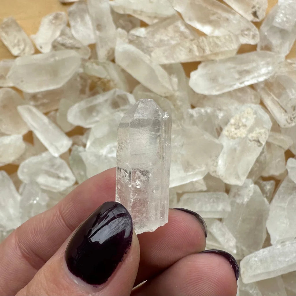 Clear Brazilian quartz crystal point with translucent facets