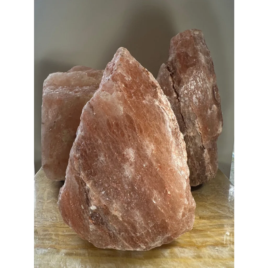 Rough pink Himalayan salt lamp crystal with natural texture and veins