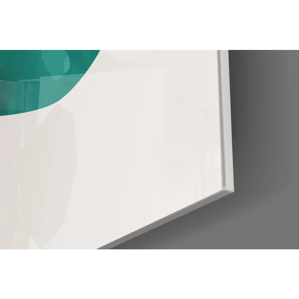 Modern teal circular glass wall art with gold accents in sleek frame