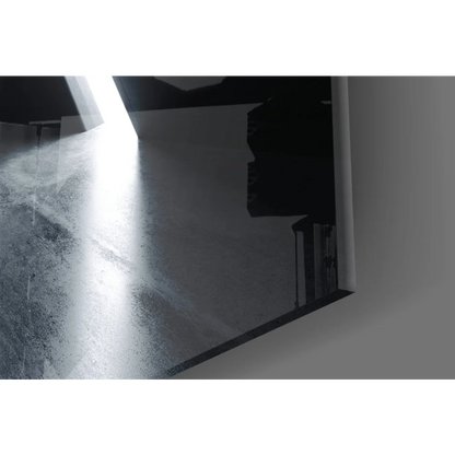 Sleek black-framed geometric tunnel glass wall art reflecting light