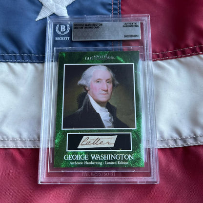 A green-framed george washington letter trading card featuring washington’s penmanship encased in a clear beckett slab