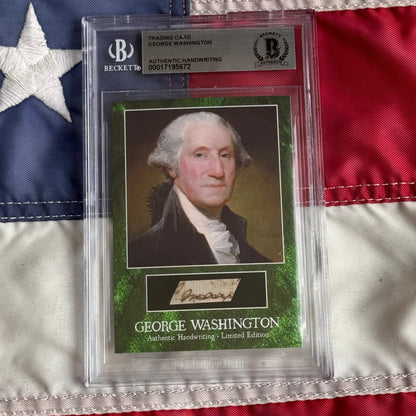 George Washington letter encapsulated trading card with authentic penmanship in clear Beckett slab on green background