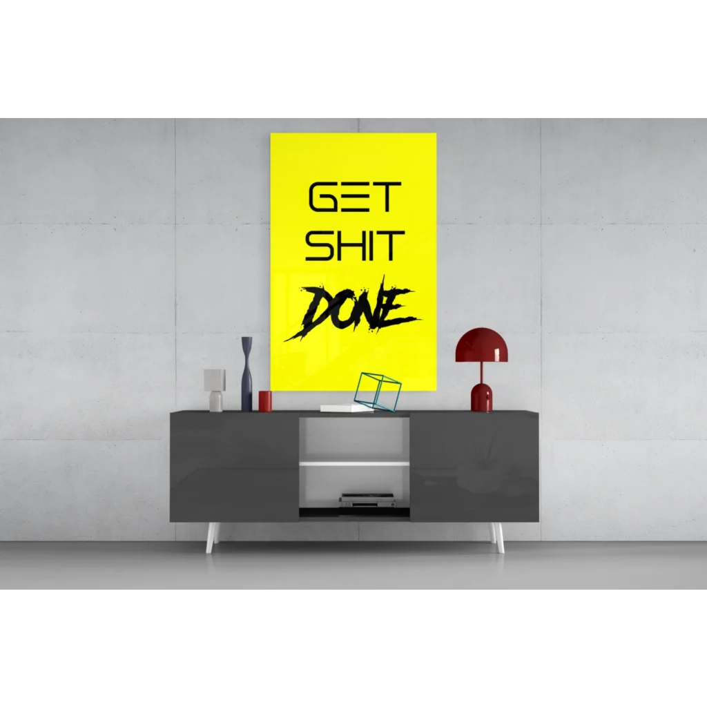 Get Shit Done yellow glass wall art with bold black text on rectangle