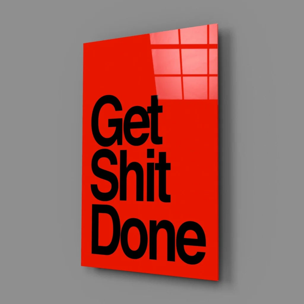 Vibrant red glossy glass wall art with bold black Get Shit Done text