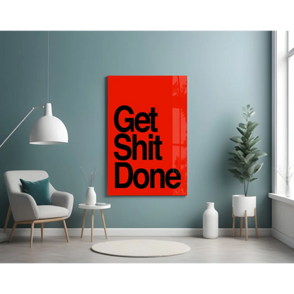 Vibrant red glass wall art with bold black Get Shit Done text on teal wall