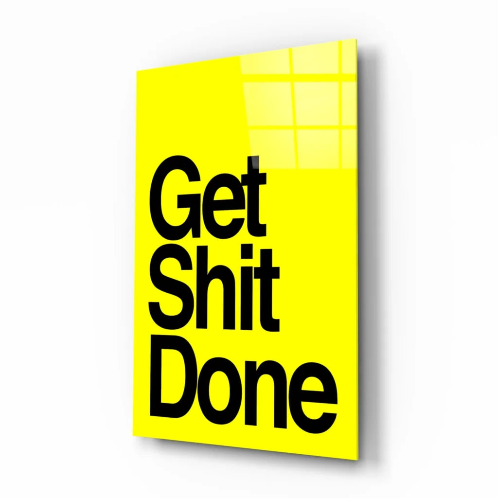 Vibrant yellow glass wall art with bold black Get Shit Done text