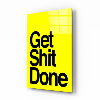Vibrant yellow glass wall art with bold black Get Shit Done text
