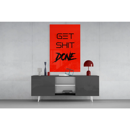 Vibrant red Get Shit Done glass wall art on gray console