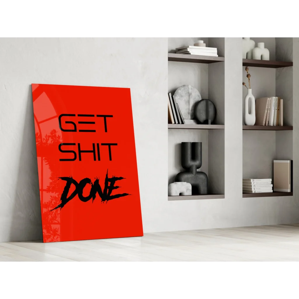Vibrant red Get Shit Done glass wall art leaning on white wall