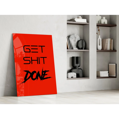 Vibrant red Get Shit Done glass wall art leaning on white wall