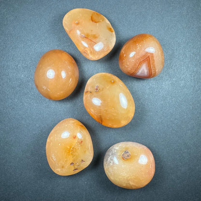 Polished orange and brown large tumbled stone collection