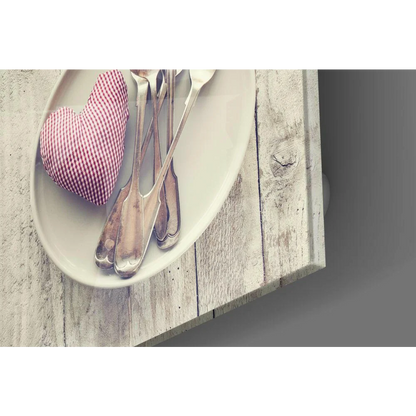 Charming red white gingham heart cushion on plate with silverware decor