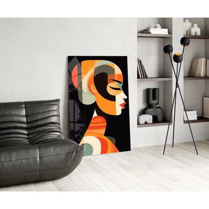 Bold geometric woman glass wall art in orange, black, green on white wall