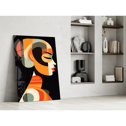 Bold Geometric Woman glass wall art in orange, black, and teal on white wall