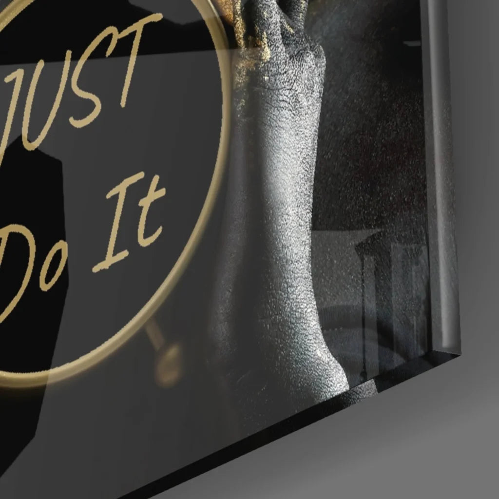 Sleek black gold glass wall art with silver hand and Just Do It phrase