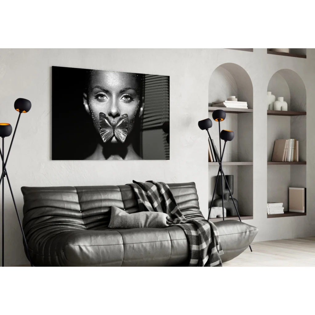 Black-and-white woman with metallic butterfly over mouth in Glitter Butterfly Kiss glass wall art