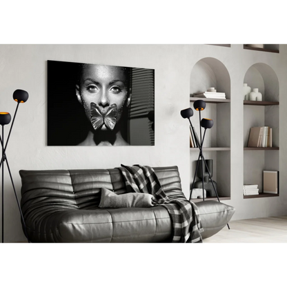 Black-and-white woman with metallic butterfly over mouth in Glitter Butterfly Kiss glass wall art