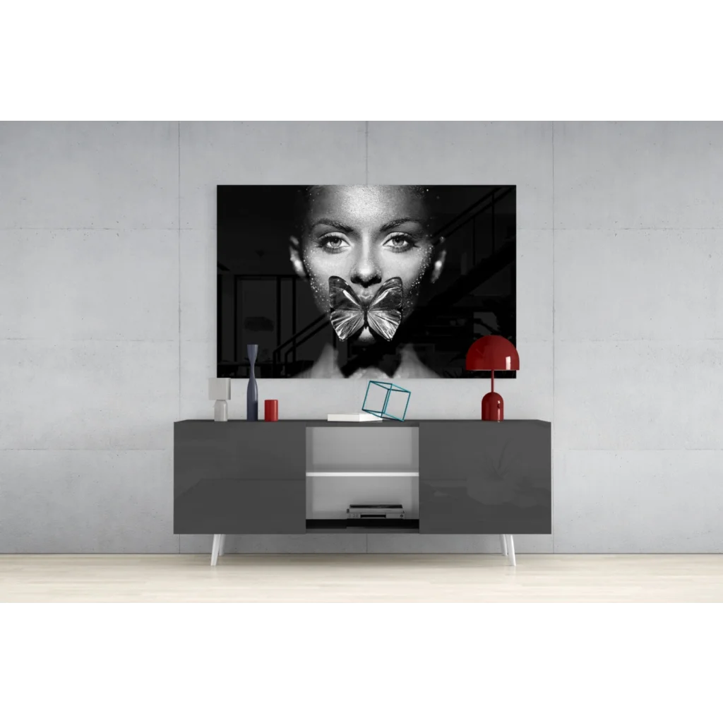 Black-and-white portrait of woman with metallic butterfly over mouth, glitter butterfly kiss glass wall art canvas