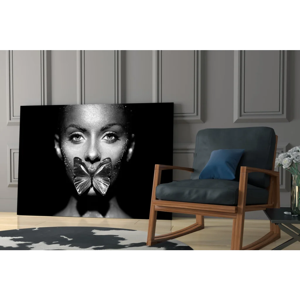 Black-and-white canvas print of womans face with metallic butterfly over mouth, glitter butterfly kiss glass wall art