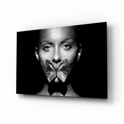 Black-and-white woman with metallic butterfly on lips glass wall art canvas print