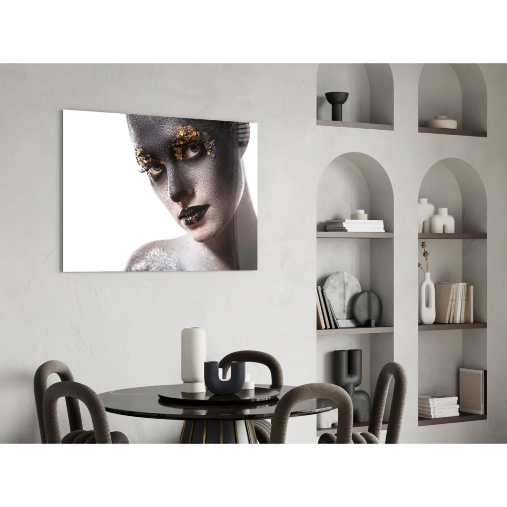 Black and gold metallic portrait glass wall art on white wall
