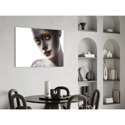 Black and gold metallic portrait glass wall art on white wall