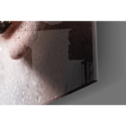 Glossy dark rectangular glass wall art mirror with textured surface reflections