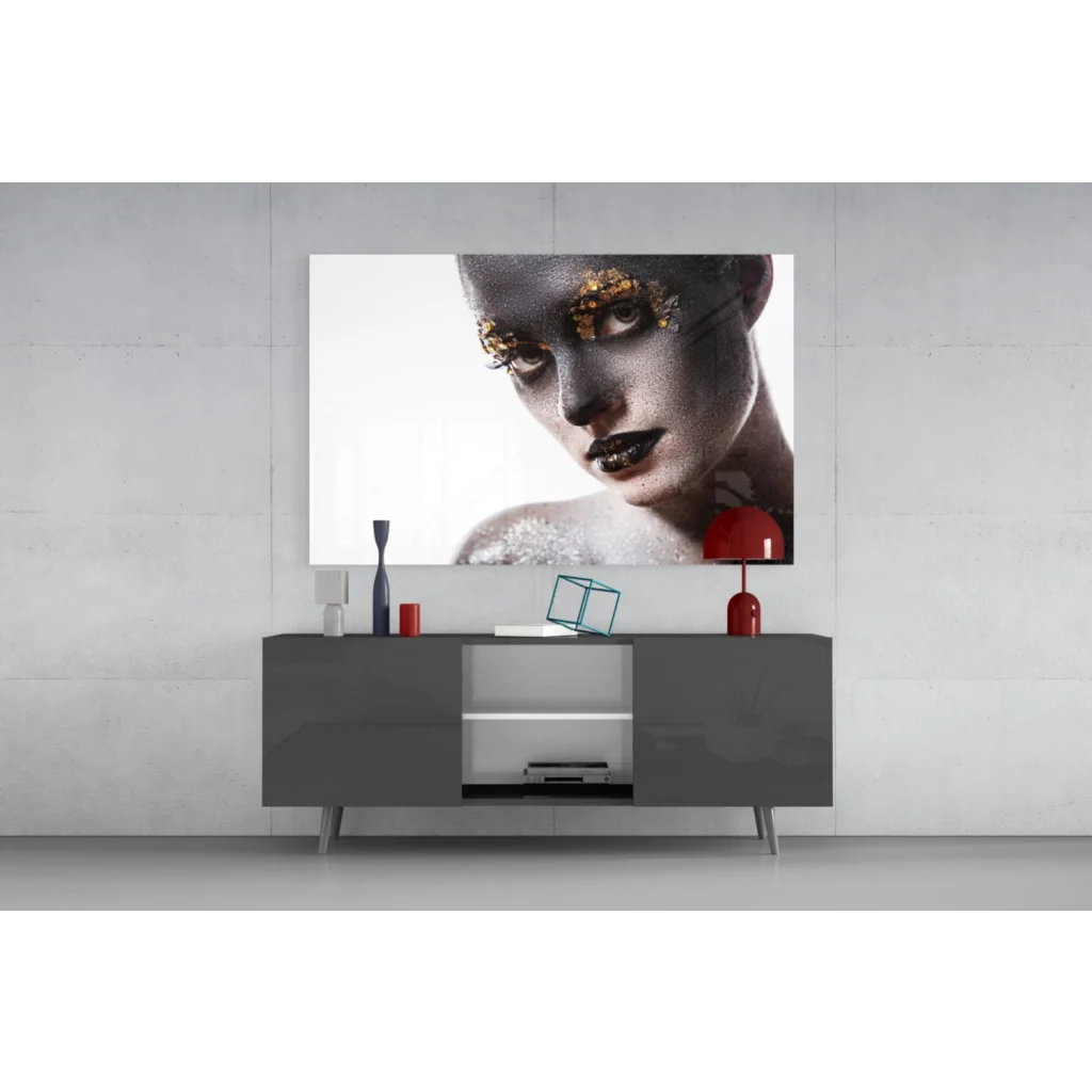 Striking black-and-gold woman portrait glass wall art with gold leaf accents