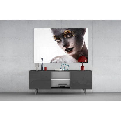 Striking black-and-gold woman portrait glass wall art with gold leaf accents