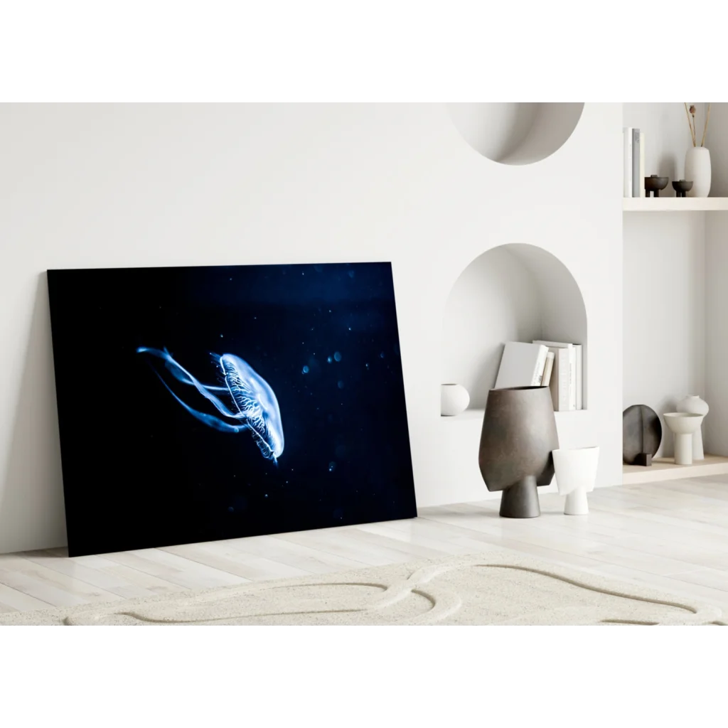 Sleek glowing blue jellyfish glass wall art with starry depths