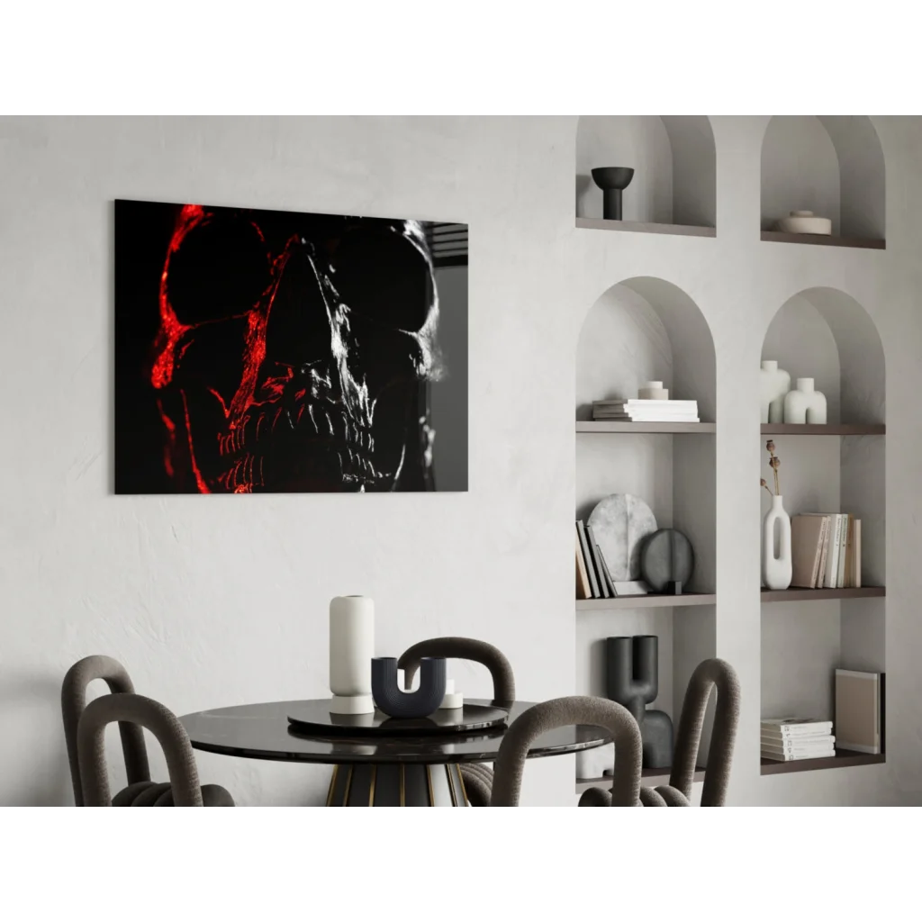 Striking black and red glowing skull glass wall art on white wall