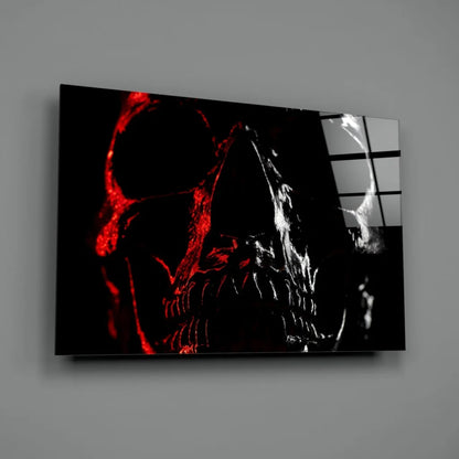 Glowing red skull wall art with crimson bone details on gray wall