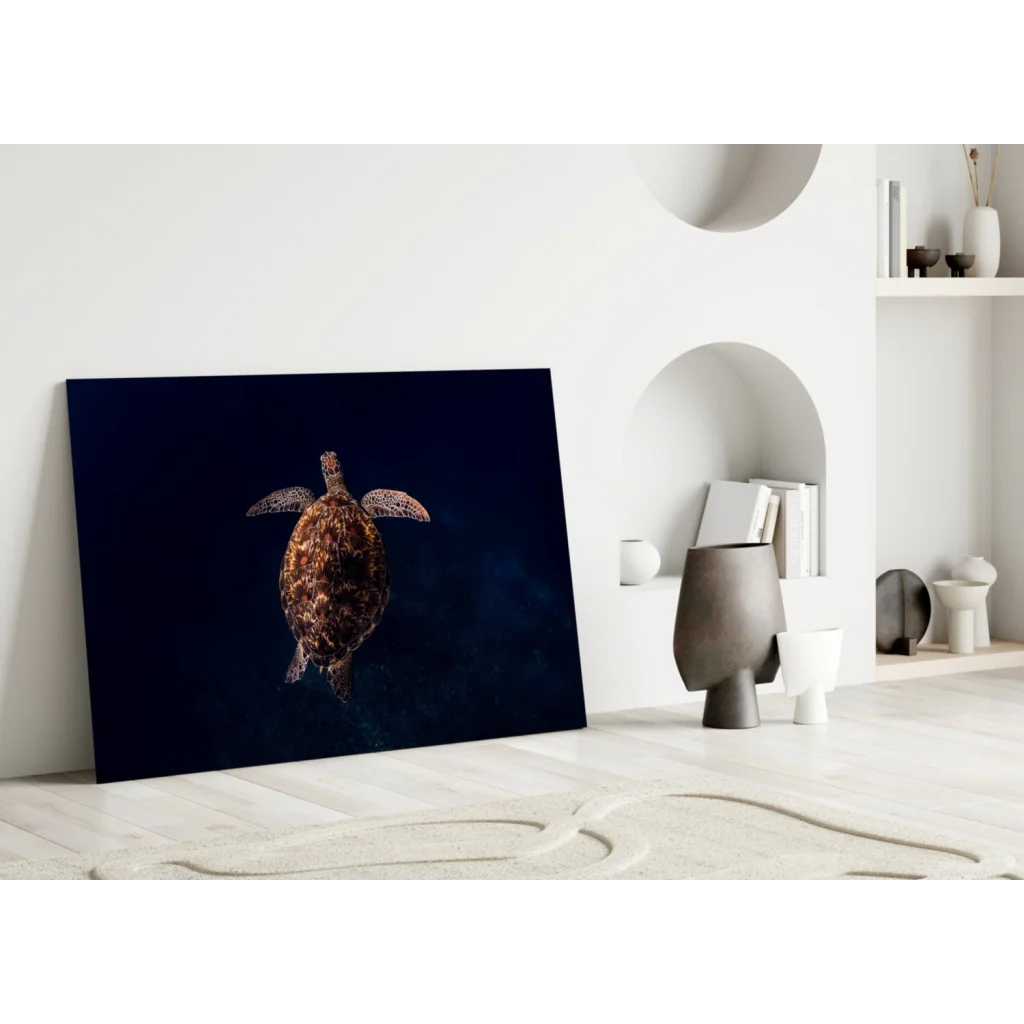 Glowing sea turtle glass wall art with textured shell on dark background