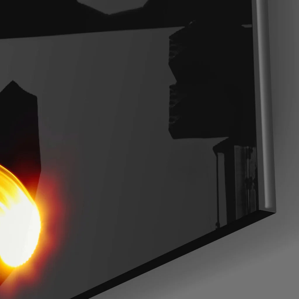 Sleek dark gray tempered glass art with glowing orange light