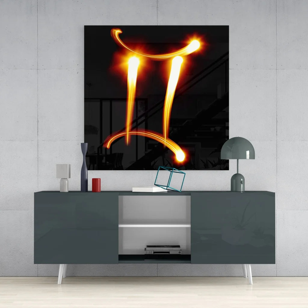 Vibrant Gemini zodiac glass art on tempered glass, glowing orange trails over gray console