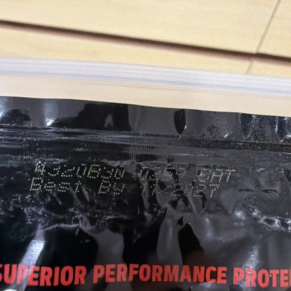 Back of GNC AMP Wheybolic Ripped Protein black bag with red superior performance text