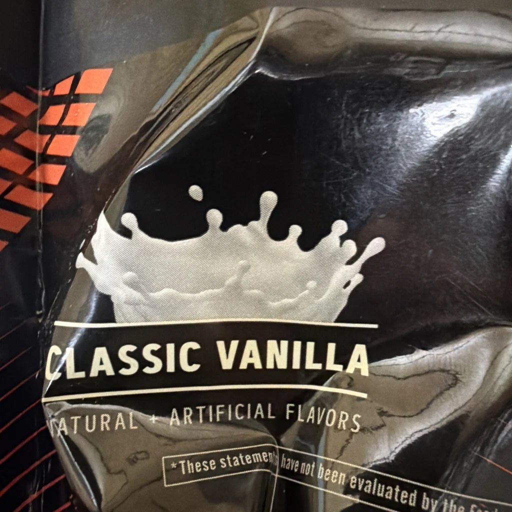 GNC AMP Wheybolic Ripped vanilla protein powder bag with milk splash