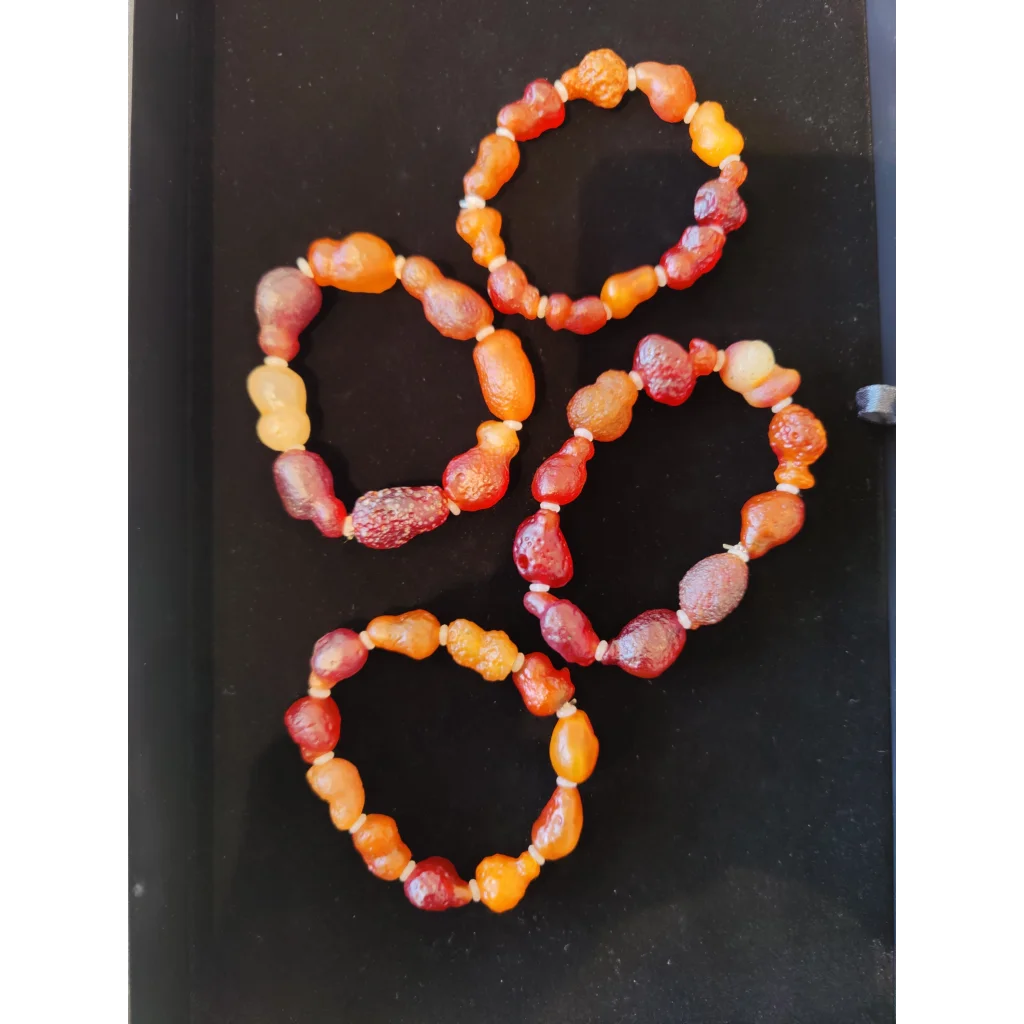 Four Gobi Desert agate bracelets with orange-red translucent beads