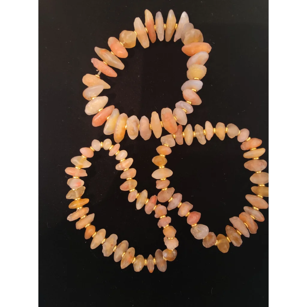 Three peach cream Gobi Desert agate stone bracelets with gold spacers