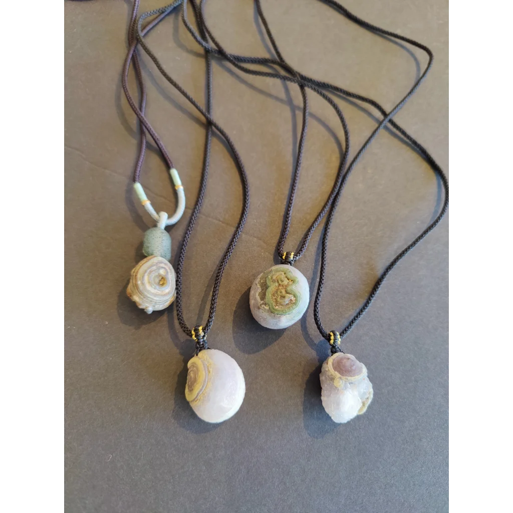 Three Gobi Desert Eye Agate black cord necklaces with polished stones
