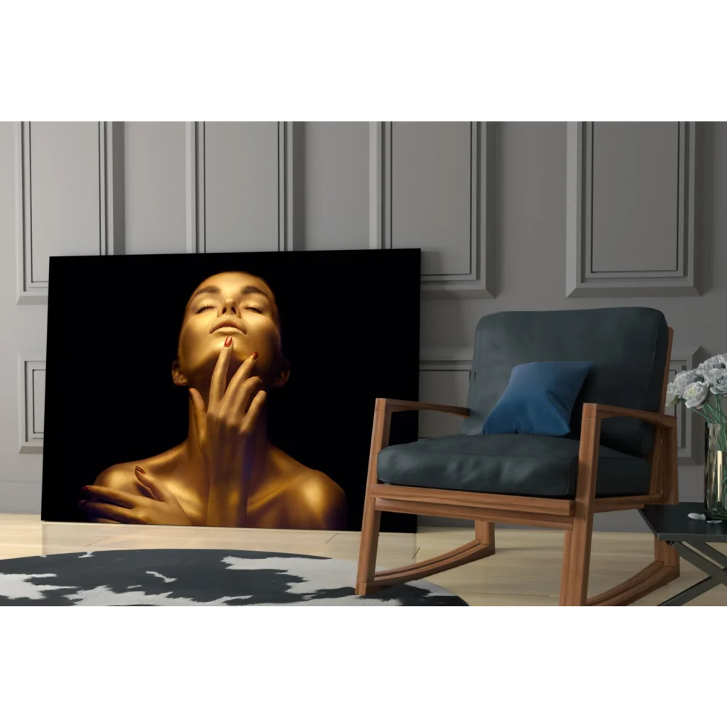 Golden glow glass wall art with elegant portrait of serene woman touching face