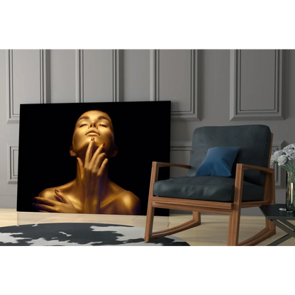 Golden glow glass wall art with elegant portrait of serene woman touching face