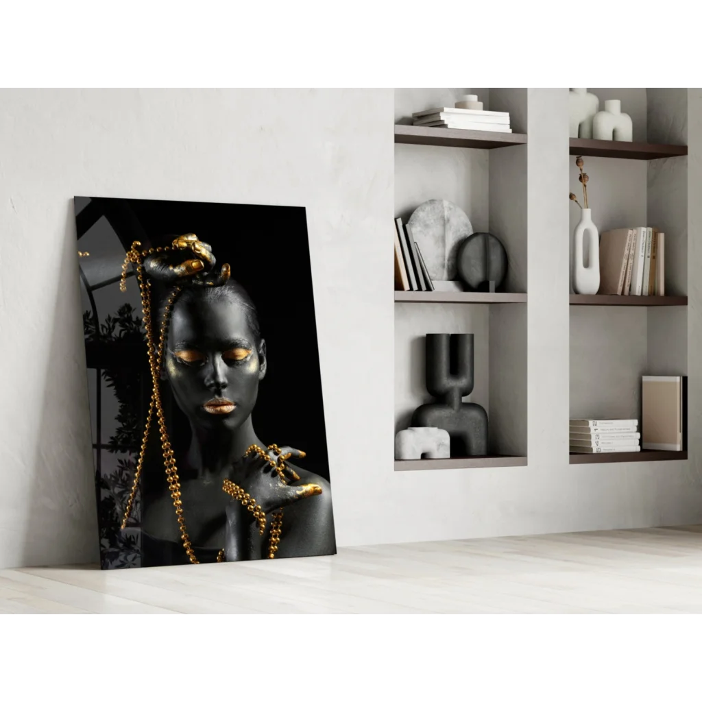 Black and gold glass wall art portrait of woman with metallic accents