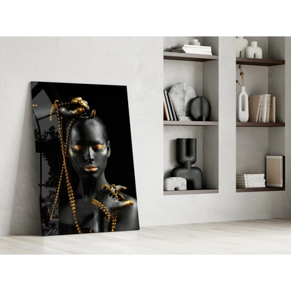 Black and gold glass wall art portrait of woman with metallic accents